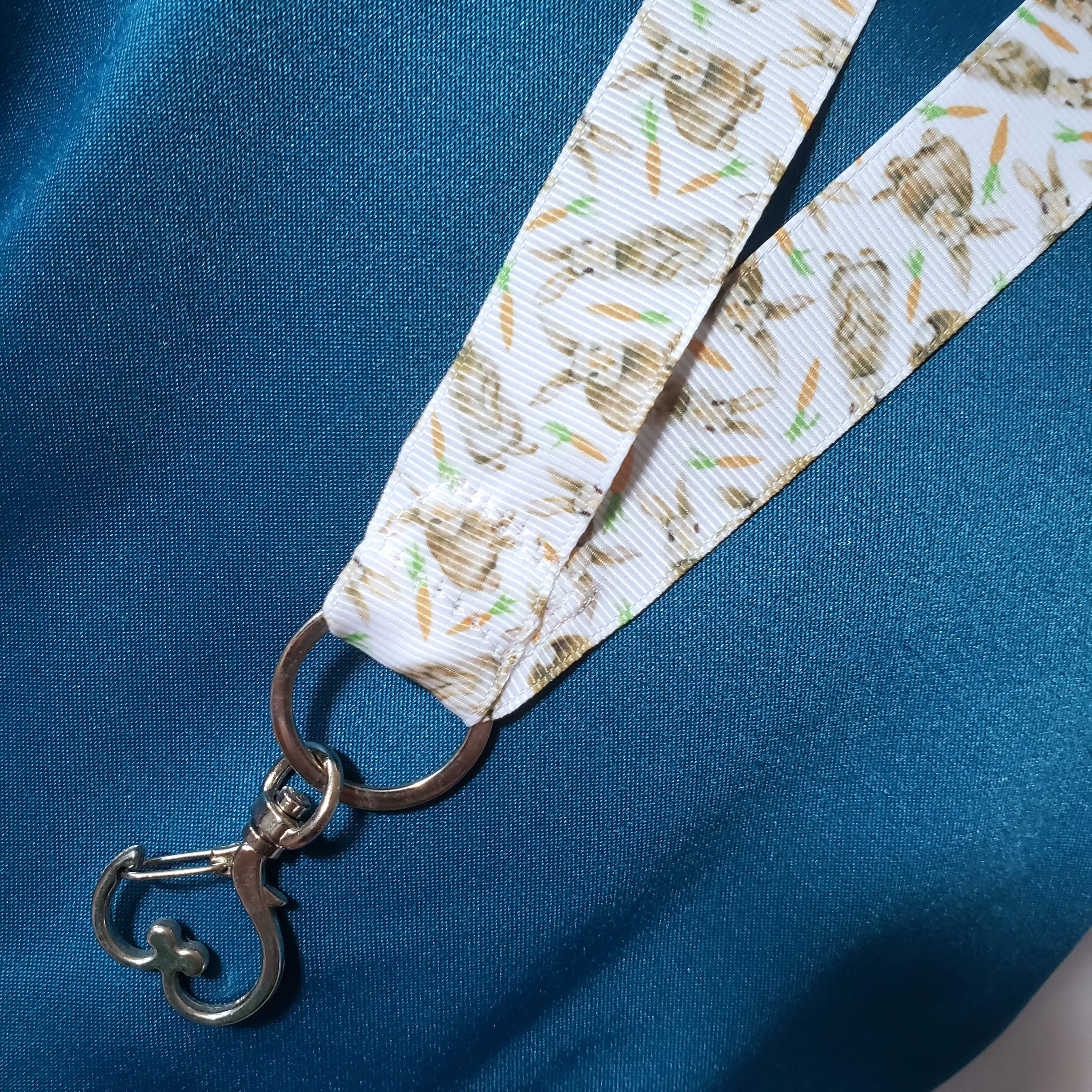 Bunnies with Carrots on White Lanyard with Silver Heart Clasp