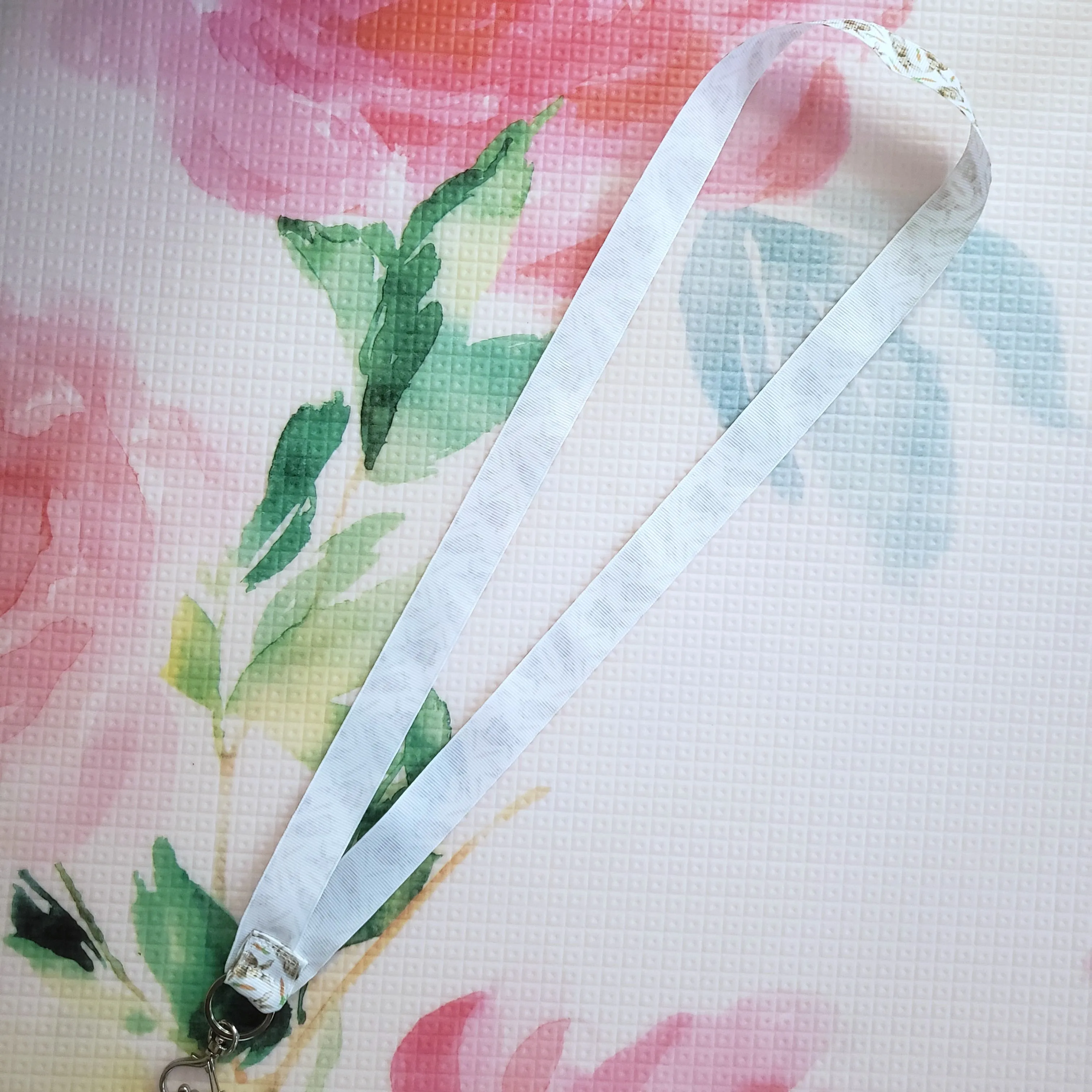 Bunnies with Carrots on White Lanyard with Silver Heart Clasp